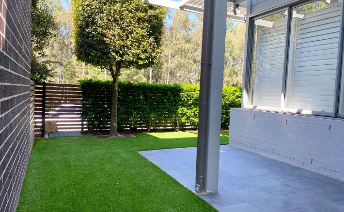 Garden with tree Synthetic grass tennis court construction